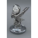 A chrome plated figure of the kneeling version of The Spirit of Ecstacy after Charles Sykes raised