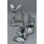 A pair of white metal Spirit of Ecstacy bookends by Sarsaparilla after Charles Sykes, one broken,