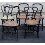 A pair of Victorian black lacquer, mother of pearl inlaid balloon back, cane seated bedroom chairs