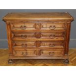 A late 18th / early 19th century Italian walnut commode, the rectangular top over four geometrically