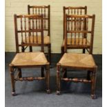 A set of four 20th century beech and elm double comb back rush seated dining chairs