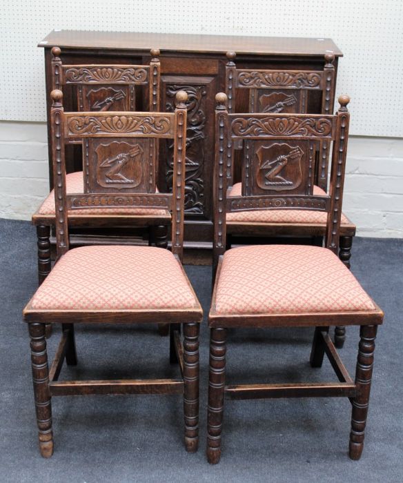 A set of eight 19th century oak dining chairs, each having ball finials over florally carved rail,