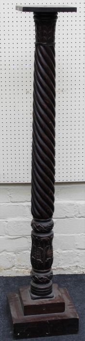 A 19th century mahogany torchere with wrythen and stiff leaf carved column, on stepped square