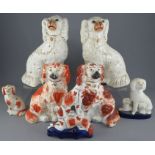 A group of mid-nineteenth century Staffordshire spaniels, c. 1850-80. To include: a pair of large