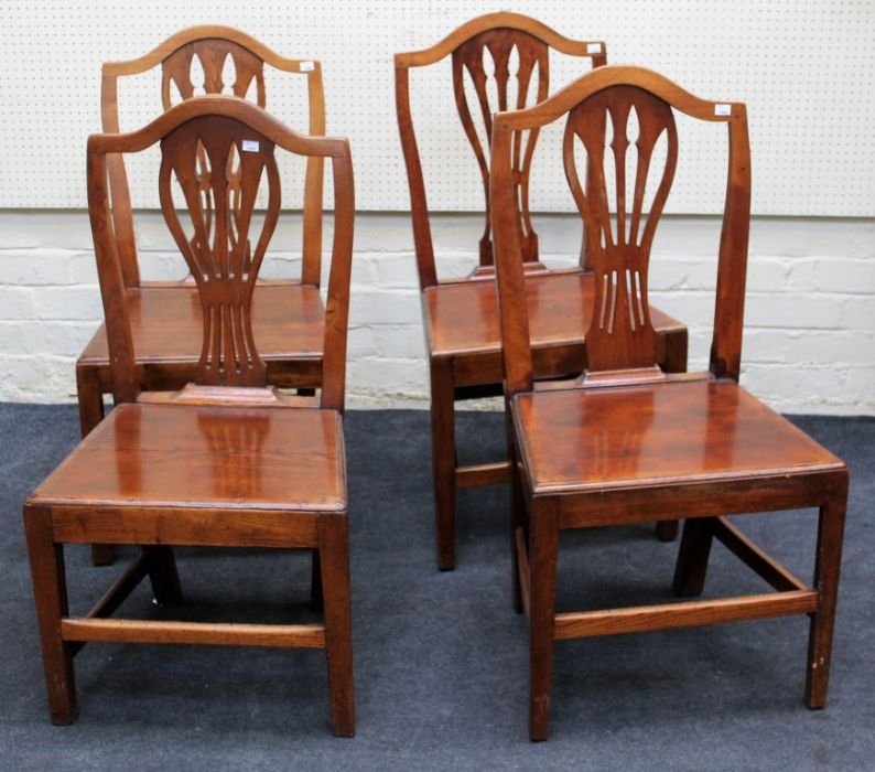 A matched set of nine early 19th century and later mahogany/elm shield back dining chairs, each