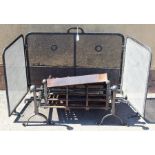 A cast and wrought iron fire grate with wrythen rail and ball finials together with a pair of