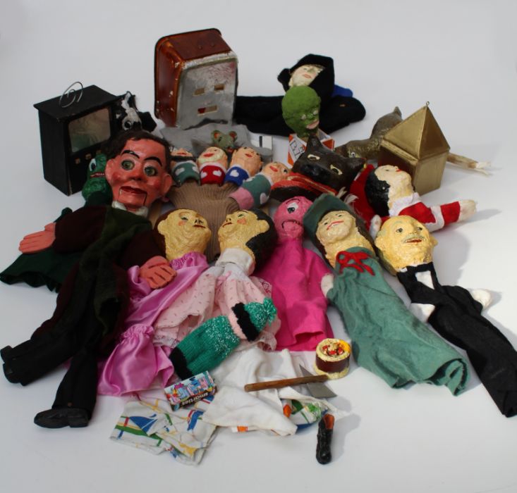 A collection of approximately one dozen mid 20th century home made papier-mâché glove and other