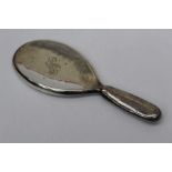A Sterling silver hand mirror hallmarked for Birmingham 1908, sponsors mark W.A