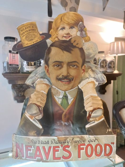 Original Neaves Food shop counter display, some age wear, along with Eucryl tooth powder shop sign.