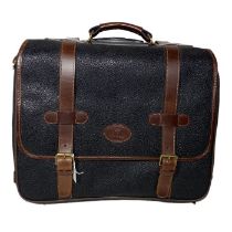 A mulberry travel case on wheels. scotch grain leather in (black or blue black), with brown straps