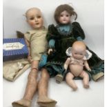 Antique dolls trio ; to include a 9” 341 AM closed mouth small bisque head baby doll , a 21”