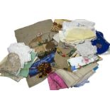 A box of linens, embroideries etc and a prayer mat (qty)