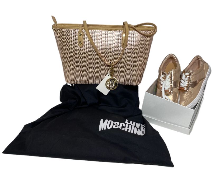 An unused  Moschino handbag in fawn leather and a woven rose gold design, still tagged and