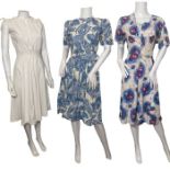 1950s volup rose print dress, a blue and white abstract orchid print dress with pockets, puffed