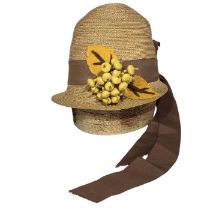 A 1920s bell cloche made from straw with milk chocolate petersham band, felt leaves and a bunch of