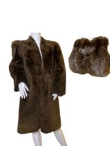 A large1940s fox fur muff, the back with zipped compartment, and a 1940s mouton lamb coat with