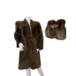 A large1940s fox fur muff, the back with zipped compartment, and a 1940s mouton lamb coat with