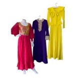 brightly coloured 1960s and 70s fashions to include hot pink chiffon evening dress by John