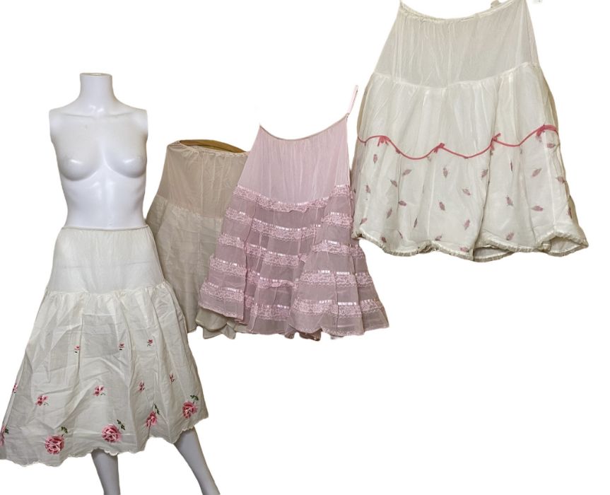 4 1950s petticoats, 5 nylon bonnets 50s/60s, a shower cap, 3 sun bonnets, 4 pinnies and washbag