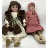 German Antique  good Schoennau 1909 dressed doll in clothing with fur trim and an AM 370 shoulder