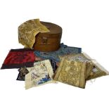 A mixed lot of fabrics, embroideries, laces etc held in an antique metal hat box. items to include