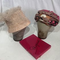 A 1960s turban made from a Christian Dior scarf, a 50s/60s bucket hat, a Schiaparelli stocking box