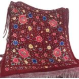 A silk, 1920s canton piano shawl in a vibrant claret shade with embroidered flowers and folliage