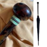 An elegant, Edwardian long handled umbrella or parasol by Thomas Brigg & Sons featuring a black,