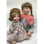 Antique Dolls ; 17” 320 Sprayed bisque toddler in original pre war dress and a German doll and a 22”