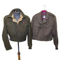 Two British army battle jackets, 1943 and 1952 dated (2)