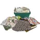 A large box of vintage dress making patterns and fabric yardage. Patterns are mostly 30s-50s and