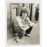 David Bowie - Relaxed image of David Bowie sitting on a doorstep. An original Photograph by S.K.R