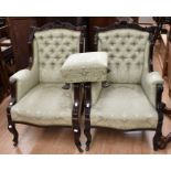 A pair of Victorian mahogany framed carved armchairs, scroll and shell top rail above upholstered