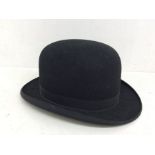 A Dunn & Co 1950's top hat, 6 3/4 size, some small marks on the lining, owned by a farmer
