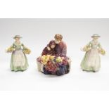 A collection of three Royal Doulton figures including Daffy Down Dilly, Christmas Morn, Flower