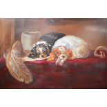 A late 19th century painted porcelain plaque, painted with King Charles Spaniels, signed Garett '95,