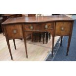 George III mahogany serpentine sideboard on spear legs, central drawer, with two side cupboard doors