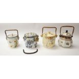 Four Losol ware, early 20th century, mixed pattern biscuit barrels with cane handles