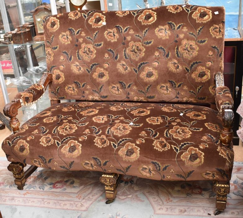 An early 20th century reproduction upholstered two-seater sofa chair, in the 18th century style,