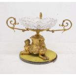 Gilt 19th century centrepiece with a cut glass bowl between three scrolled arms above three seated