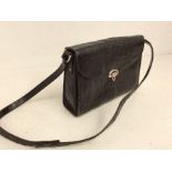An alligator black leather bag, 1950's envelope style flap and brass clasp, leather strap with brass