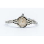 Hermes- a vintage steel case ladies wristwatch, comprising a round dial with applied gilt baton