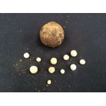 Small Civil War cannon ball along with lead shot musket balls