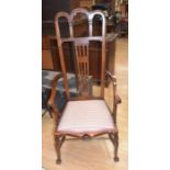 An Arts and Crafts Edwardian high back armchair, mahogany, with church arched top to back,