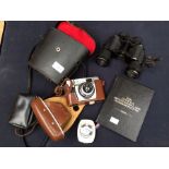 A 1950's AGFA automatic camera in case, vintagve Prinz binoculars along with The Official
