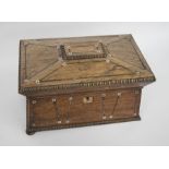 Large 19th century mahogany sarcophagus tea caddy with two tea compartments on either side of a