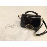 A Lulu Guinness black patent handbag, 2000, with original dust bag, designer name printed on