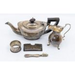 A group of early 20th Century silver to include: batchelor's teapot (ebonised handle and finial);