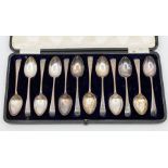 A set of twelve George V engraved Old English pattern teaspoons, hallmarked by Walter Trickett,