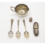 A collection of silver to include three various teaspoons and a thimble, various dates and makers